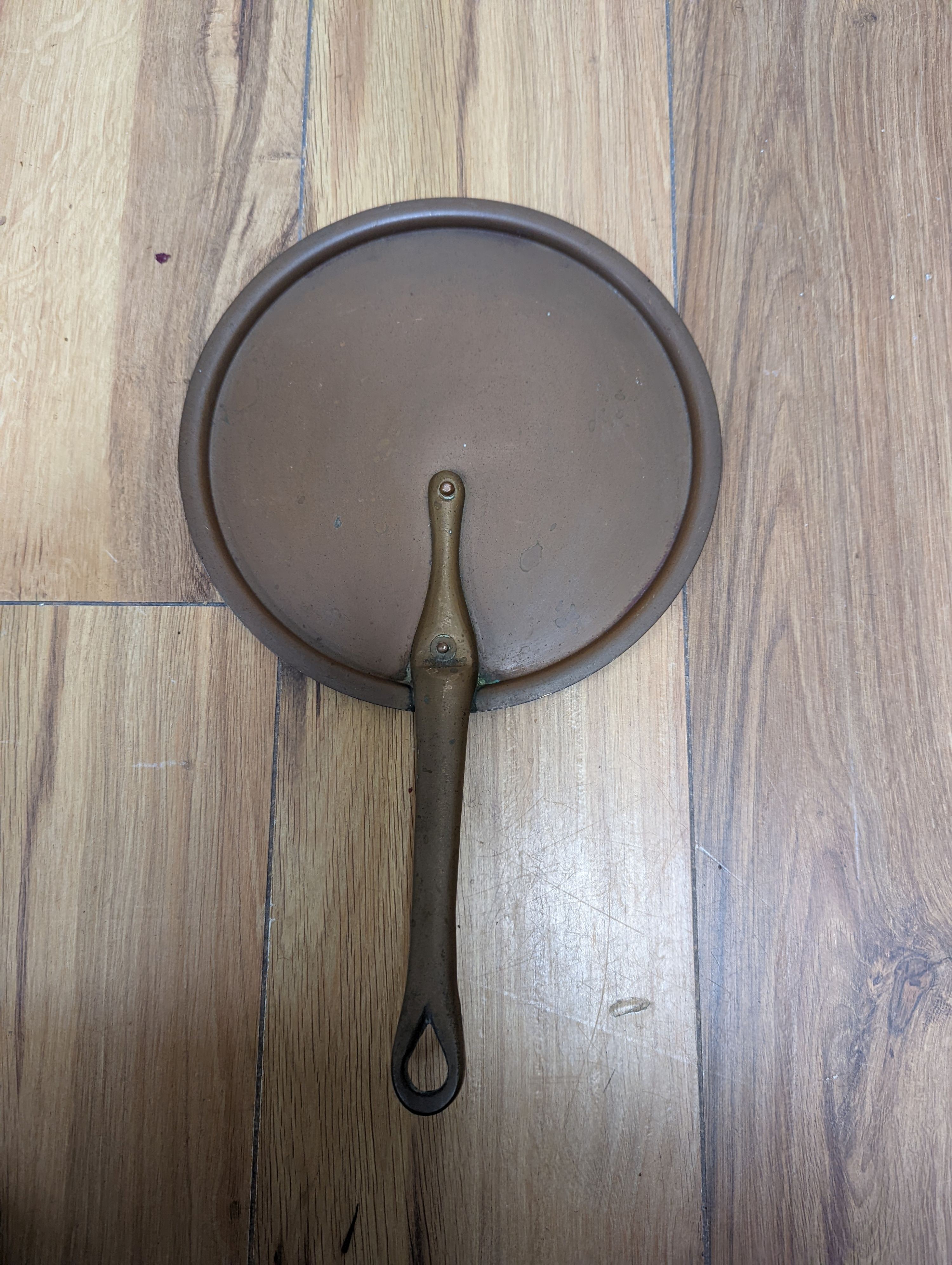 A group of three Jaeggi & Sons copper saucepans